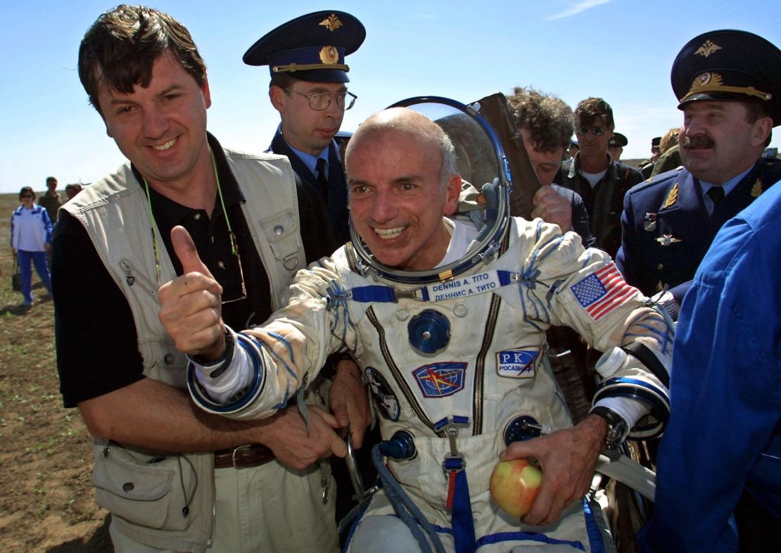The world's first space tourist, Dennis Tito, celebrates after landing near the Kazakh town of Arkalyk in 2001.