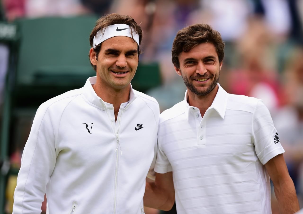 Roger Federer, left, and Gilles Simon were all smiles before their quarterfinal at Wimbledon. Federer would be the one smiling at the end. 