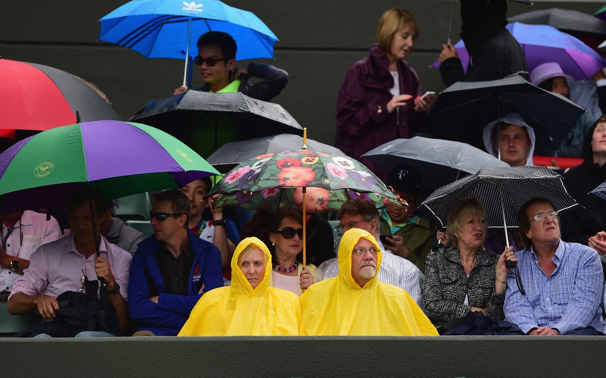 After glorious weather for most of Wimbledon, light rain affected both of the early quarterfinals. The delays were minimal, though, and play was completed well in time. 