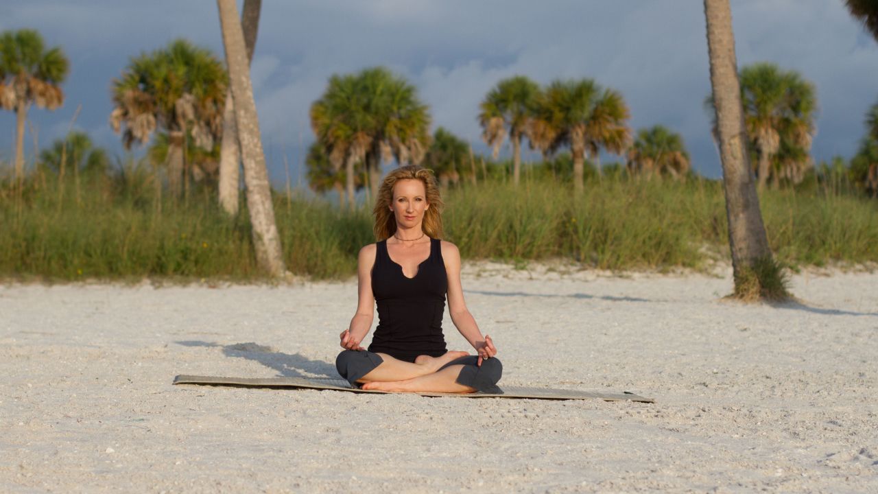 <strong>Easy seated pose:</strong> Sit cross-legged, facing the ocean. Rest your hands on your legs. Practice yoga's jnana mudra, a symbolic hand gesture of wisdom, by touching your thumb and index finger together. Breathe deeply for five or more breaths, taking in all aspects of your surroundings with your five senses.<br /><br />Click through the gallery for more yoga poses by the sea: <br />