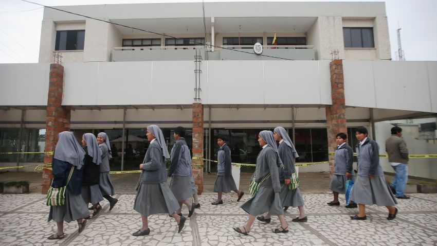 SANTA CRUZ, BOLIVIA - JULY 08: Nuns walk past a shuttered building on a street near the area where Pope Francis will hold Mass on July 8, 2015 in Santa Cruz, Bolivia. Pope Francis will arrive in Santa Cruz July 8 and hold his open-air Mass there July 9 during his three-country swing through Ecuador, Bolivia and Paraguay. (Photo by Mario Tama/Getty Images)