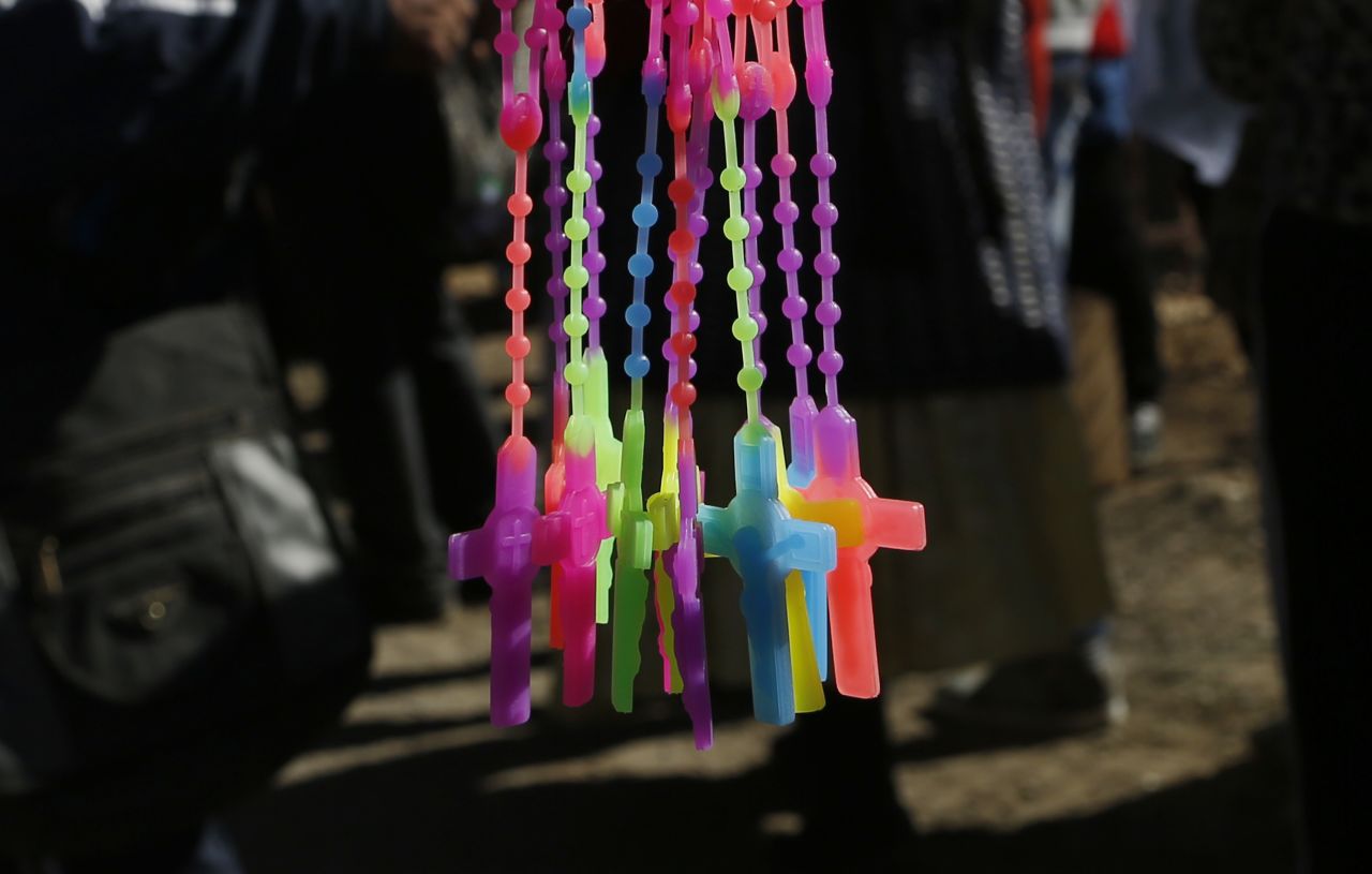 Multicolored crucifixes are sold near the airport in El Alto on July 8.