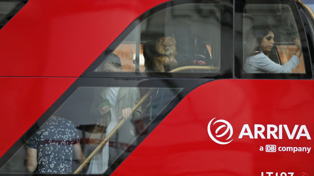 Commuters ride a packed bus. People have been urged to travel outside peak hours.<br />