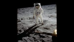 Astronaut Buzz Aldrin walks on the surface of the moon near the leg of the lunar module Eagle during the Apollo 11 mission. Mission commander Neil Armstrong took this photograph with a 70mm lunar surface camera. While astronauts Armstrong and Aldrin explored the Sea of Tranquility region of the moon, astronaut Michael Collins remained with the comma