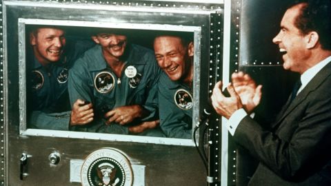 President Richard Nixon welcomes the astronauts back to Earth: from left, Armstrong, Collins and Aldrin. The astronauts were received by the President from their mobile quarantine unit, which was thought to help prevent the spread of contagions caught on the moon. The quarantine practice was discontinued a couple years later after Apollo 14's mission.