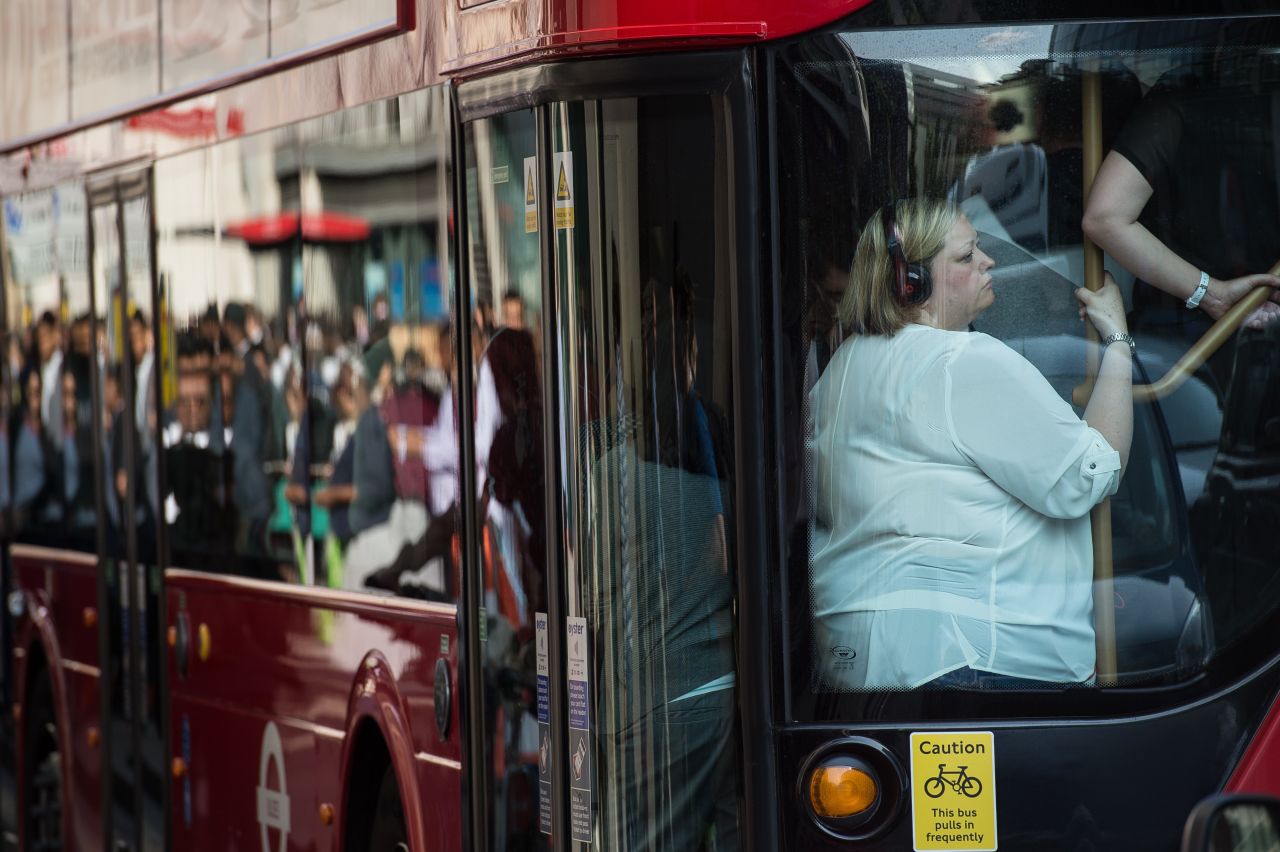 People squeeze onto a bus on July 9.