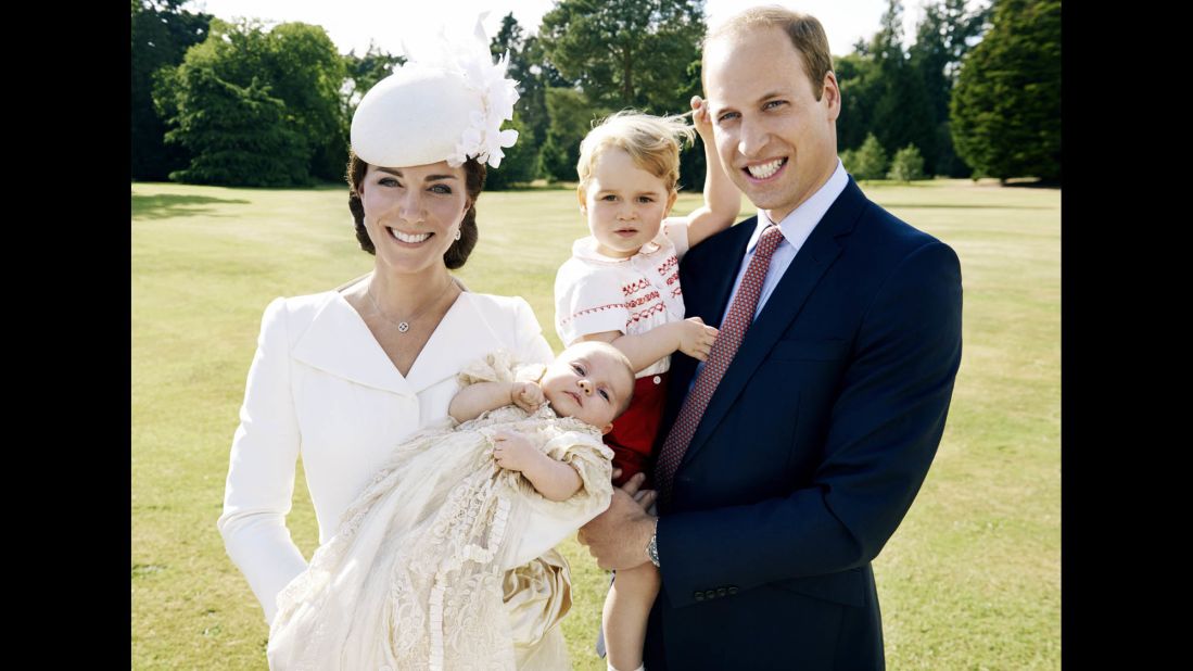 William and Catherine pose with their two children at Charlotte's christening.