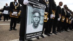 A marcher holds a poster of Jimmie Lee Jackson, a civil rights activist who was beaten and shot by Alabama State troopers in 1965, during the 50th anniversary commemoration of the Selma to Montgomery civil rights march on March 8, 2015 in Selma, Alabama. (Photo by Justin Sullivan/Getty Images)