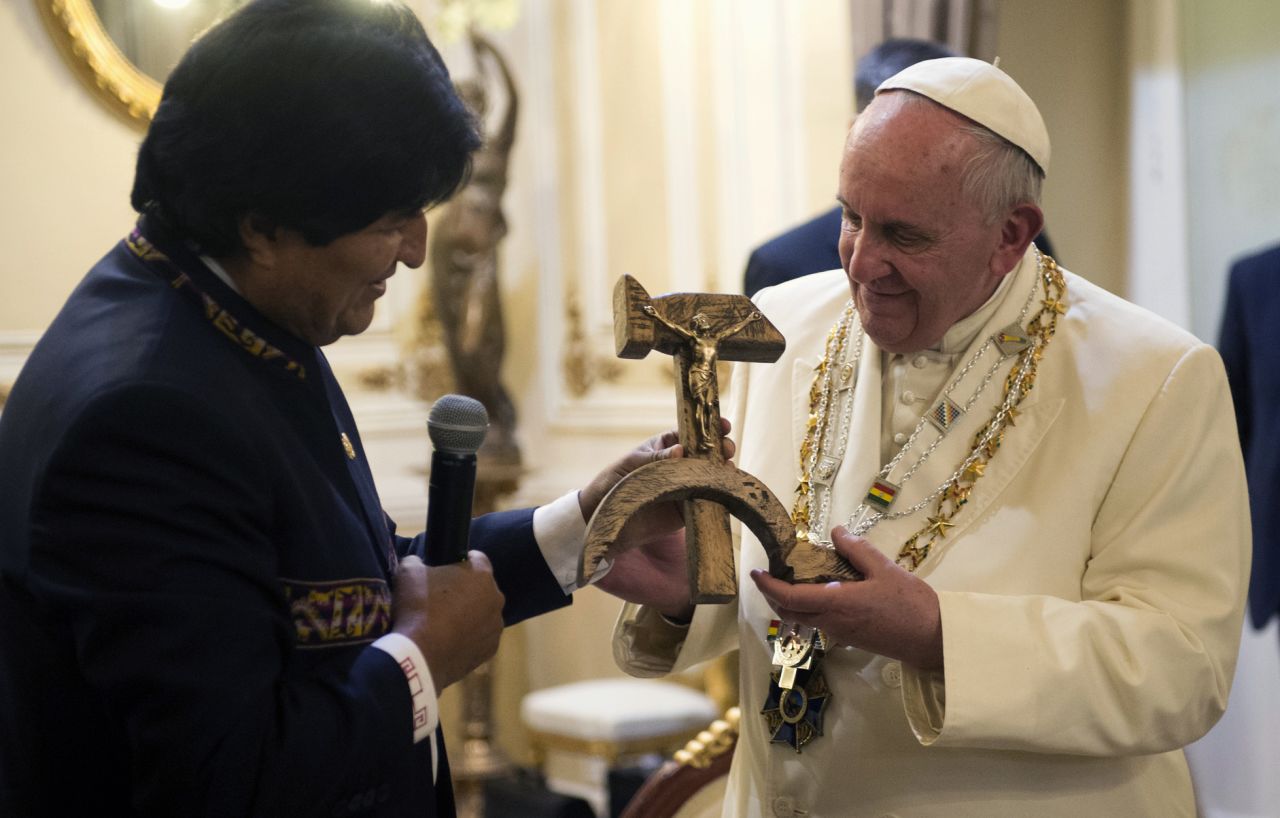 Morales presents the Pope with a gift of a crucifix carved into a wooden hammer and sickle -- the Communist symbol uniting labor and peasants -- in La Paz, Bolivia, on Wednesday, July 8.