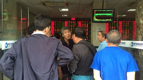 Postmortem: Elderly investors trade opinions on the stock markets at a brokerage house in downtown Shanghai after another major sell-off on Wednesday. 