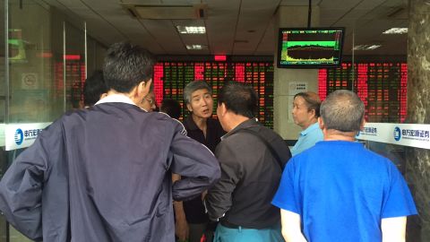 Postmortem: Elderly investors trade opinions on the stock markets at a brokerage house in downtown Shanghai after another major sell-off on Wednesday.