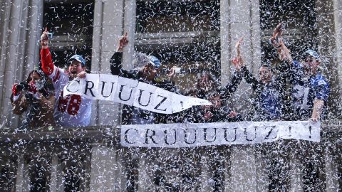 In recent years, most of New York's ticker tape parades have been in celebration of a sports team. Here, fans hold banners supporting New York Giants player Victor Cruz. The team won the Super Bowl in 2012.  