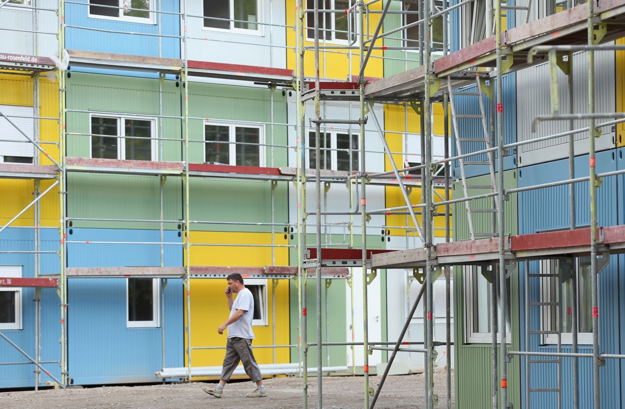 A worker walks through a container facility under construction in the Zehlendorf district that will house refugees and asylum applicants on July 9, 2015 in Berlin, Germany. This will be Berlin's sixth container accommodation as the city expands its capacity to house arriving refugees. Germany received the highest number of asylum seekers last year, with over 173,000 applications, according to a report by the United Nations.