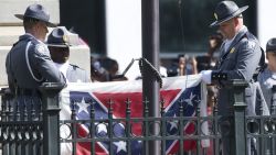 An honor guard from the South Carolina Highway patrol removes the Confederate battle flag from the Capitol grounds in Columbia, S.C., Friday, July 10, 2015, ending its 54-year presence there. (AP Photo/John Bazemore)