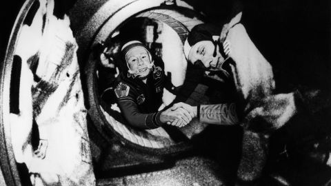 Commander of the Soviet crew of Soyuz Alexei Leonov, left, and commander of the American crew of Apollo Thomas Stafford shake hands in space after the Apollo and Soyuz spacecrafts docked on July 17, 1975.