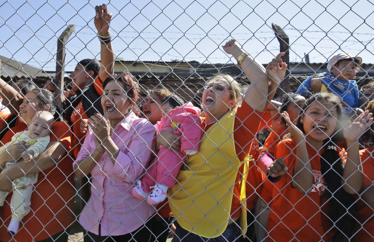 Female inmates, some holding their babies, shout, "We want your blessing!" as the Pope leaves Palmasola prison on July 10.