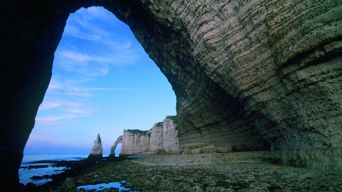<strong>Etretat: </strong>Soaring natural arches formed by coastal erosion are the key attraction at Etretat, a small town on Normandy's Alabaster Coast.
