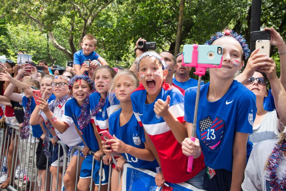 Young fans line the parade route. The cost of the parade is reportedly $2 million.