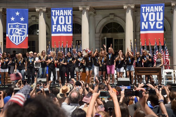 Mayor Bill de Blasio salutes the U.S. women's soccer team at a City Hall ceremony Friday.