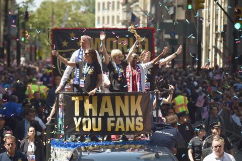 The U.S. women's soccer team celebrates its  World Cup victory with a ticker tape parade in New York on Friday, July 10. Midfielder Megan Rapinoe is holding the trophy.