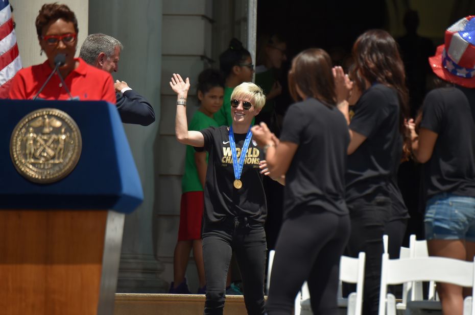 Robin Robbins, left, and Mayor Bill de Blasio celebrate soccer player Megan Rapinoe, center, and her fellow World Cup champions at City Hall. 