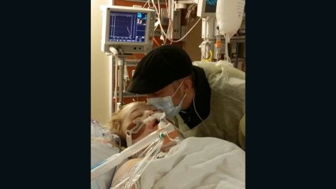 Dalton Prager kisses his wife, Katie, after her lung transplant.