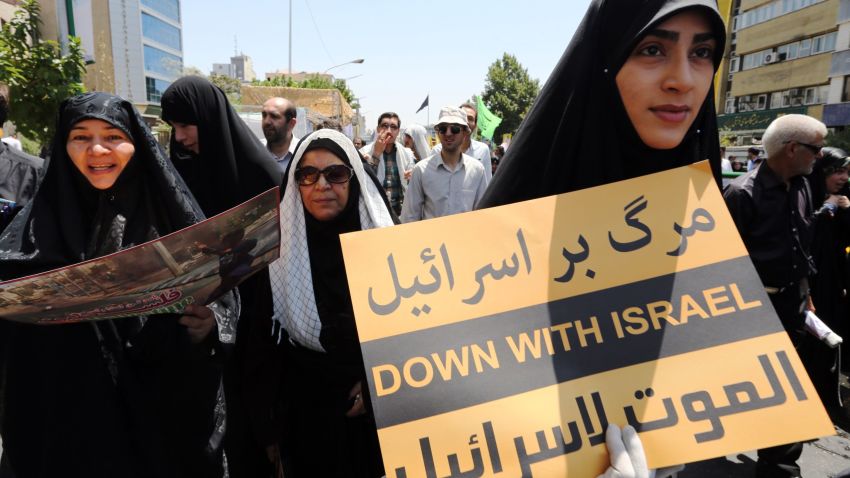 An Iranian woman holds a placard during a demonstration to mark the Quds (Jerusalem) International day in Tehran on July 10, 2015. AFP PHOTO / ATTA KENAREATTA KENARE/AFP/Getty Images