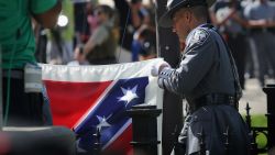 A South Carolina honor guard lowers the Confederate flag from the Statehouse grounds on July 10, 2015 in Columbia, South Carolina.