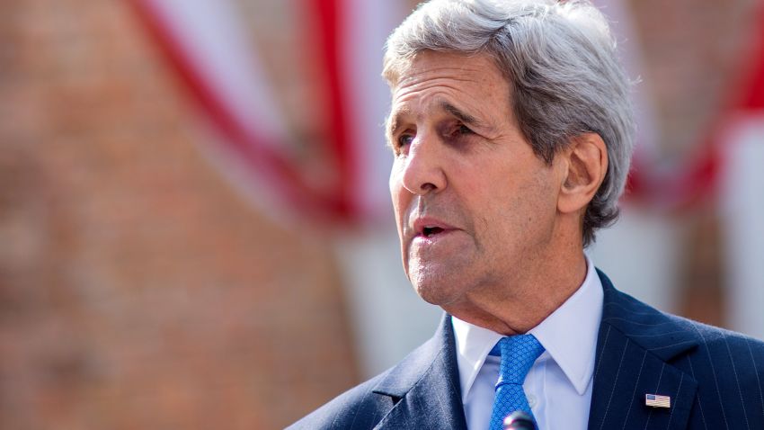 U.S. Secretary of State John Kerry walks delivers a statement on Cuba outside the hotel where the Iran nuclear talks meetings are being held in Vienna, Austria, July 1, 2015.