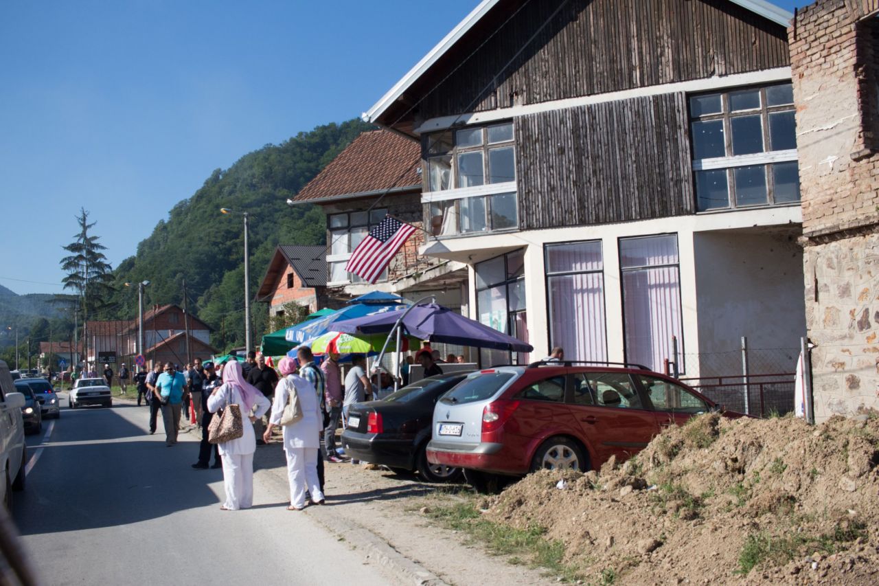 An American flag flies outside a house on the road to Srebrenica. Though NATO intervention and an American-brokered peace brought the Bosnian war to an end, many also blame President Bill Clinton for failing to stop the conflict earlier.