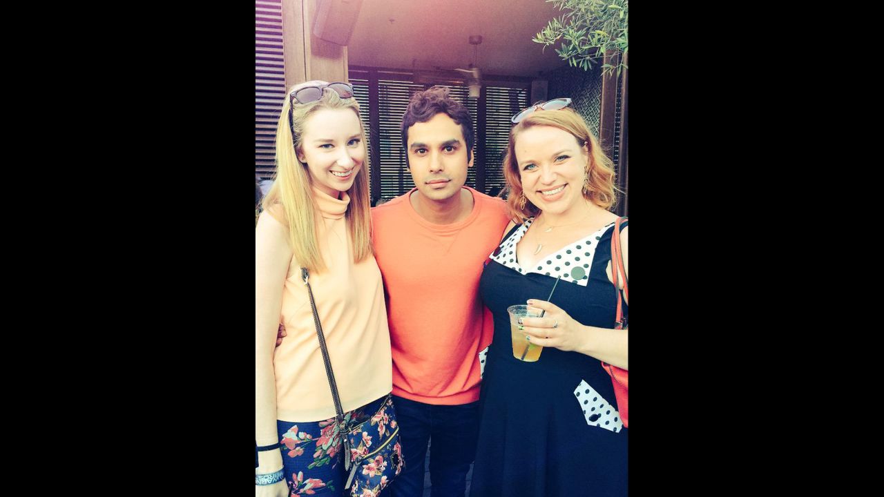 Kunal Nayyar moderated a panel for his hit series "The Big Bang Theory" and later paused for a photo with Emma Loggins (left).