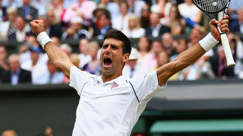 ONDON, ENGLAND - JULY 12: Novak Djokovic of Serbia celebrates after winning the Final Of The Gentlemen's Singles against Roger Federer of Switzerland on day thirteen of the Wimbledon Lawn Tennis Championships at the All England Lawn Tennis and Croquet Club on July 12, 2015 in London, England. (Photo by Clive Brunskill/Getty Images)