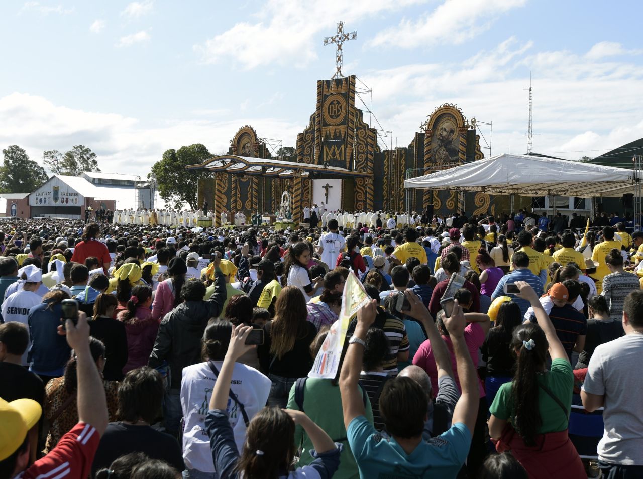 The faithful attend the Mass at Nu Guazu field in the outskirts of Asuncion on July 12.