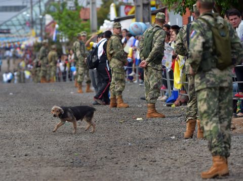 Soldiers stand guard in Asuncion's Banado Norte neighborhood ahead of the Pope's arrival on July 12.