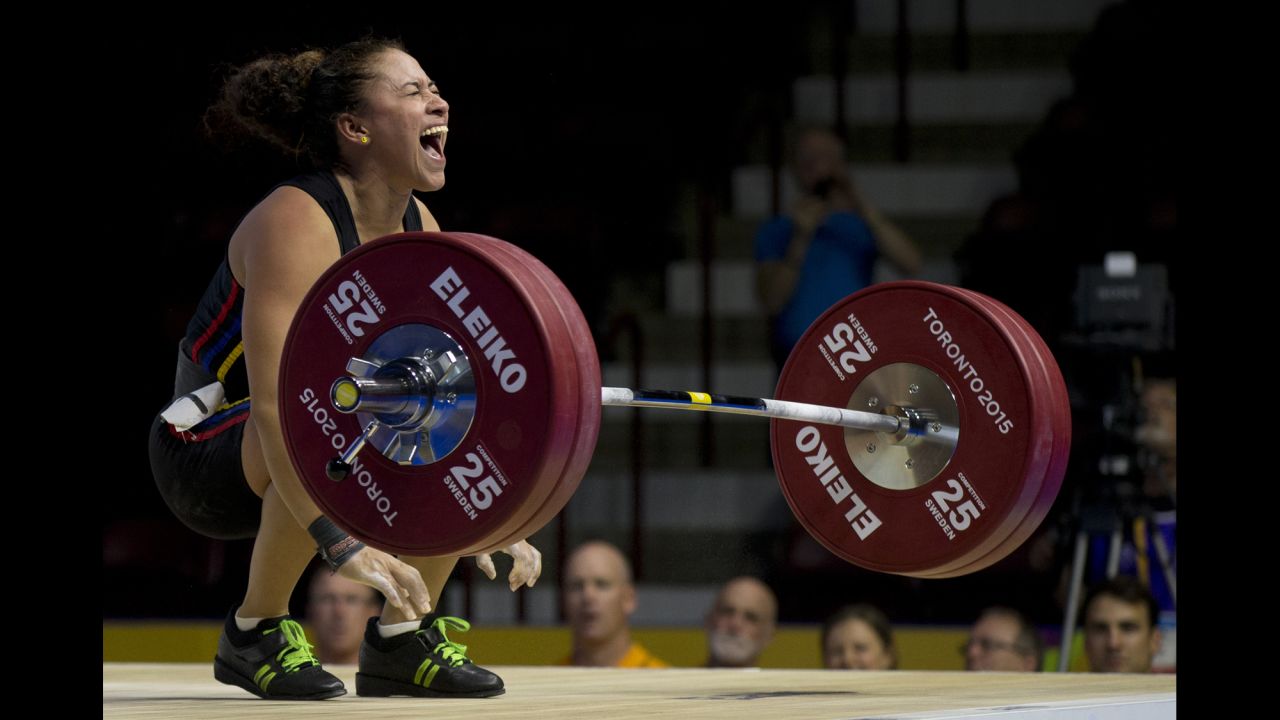 Venezuelan weightlifter Yusleidy Figueroa Roldan shouts after struggling on a lift attempt Sunday, July 12, during the Pan American Games. She won silver in her weight class.