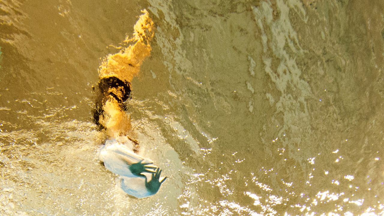 American diver Maren Taylor pierces the water's surface while competing on the 3-meter springboard Sunday, July 12, at the Pan American Games.
