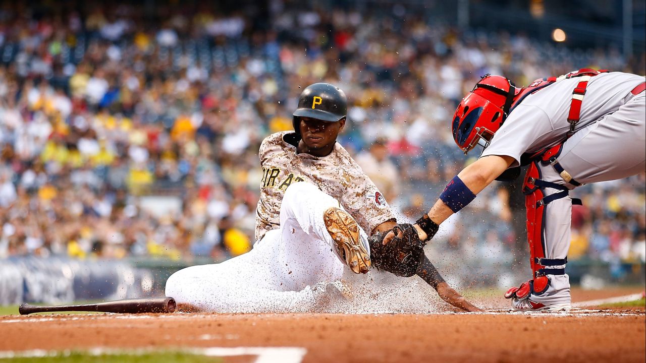 Pittsburgh's Gregory Polanco is tagged out at home plate by St. Louis catcher Yadier Molina on Thursday, July 9.