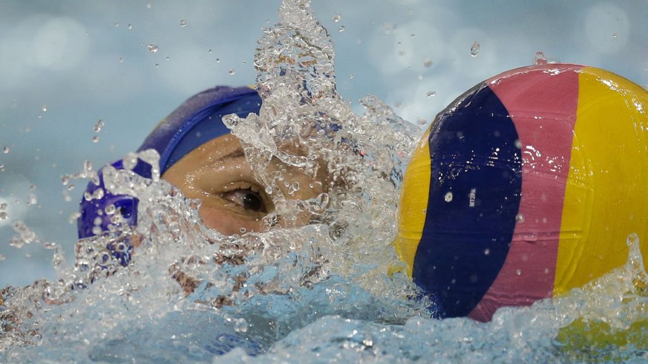 Brazil's Gabriela Mantellato Dias swims with the ball during a water polo match at the Pan American Games on Thursday, July 9.