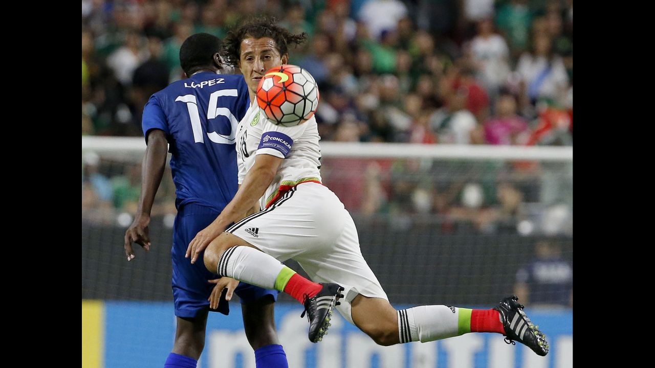 Mexico midfielder Andres Guardado kicks the ball in front of Guatemala defender Dennis Lopez during a Gold Cup match Sunday, July 12, in Glendale, Arizona.