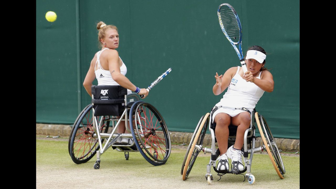 Yui Kamiji, right, and Jordanne Whiley play in Wimbledon's wheelchair doubles final against Jiske Griffioen and Aniek Van Koot on Sunday, July 12. Kamiji and Whiley won the match to defend their title.