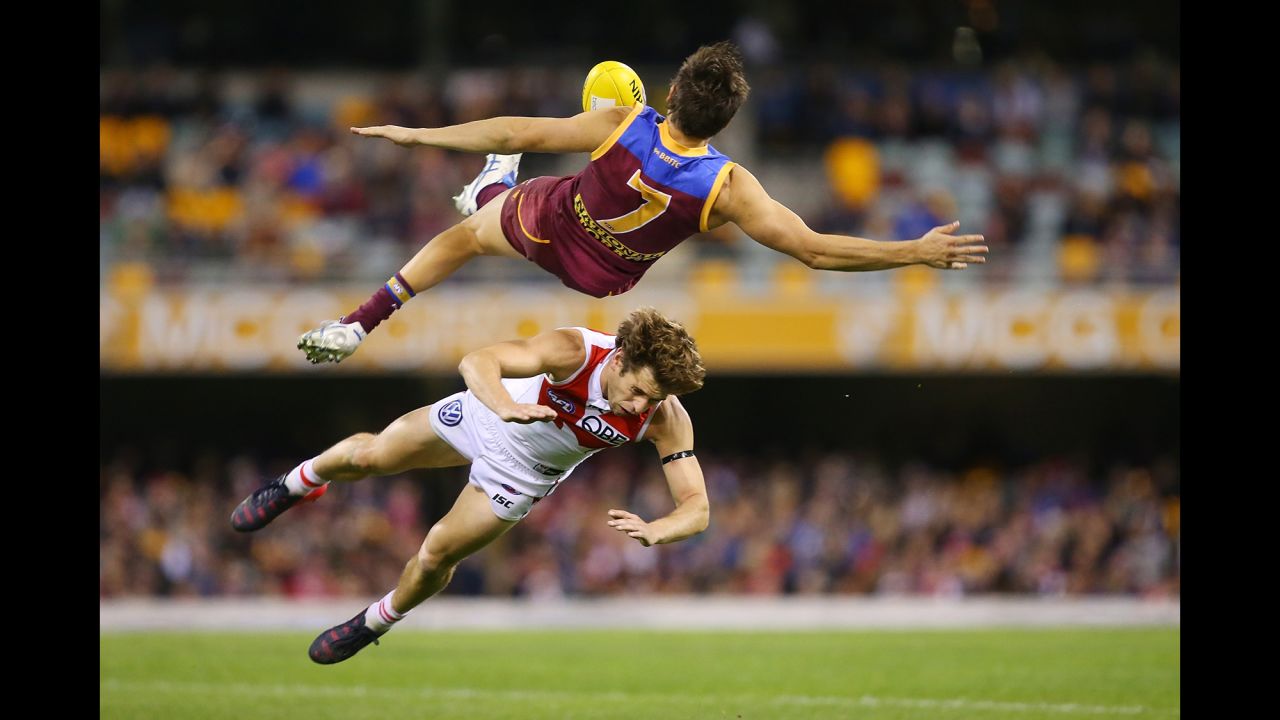 Brisbane's Jed Adcock goes flying after colliding with Sydney's Nick Smith during an Australian Football League match on Sunday, July 12. 