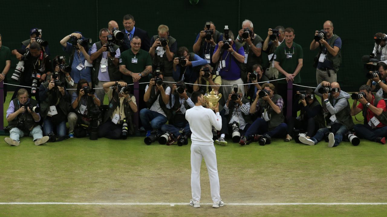 Novak Djokovic holds his Wimbledon trophy after defeating Roger Federer in the final on Sunday, July 12. The Serbian has now won nine Grand Slam titles.