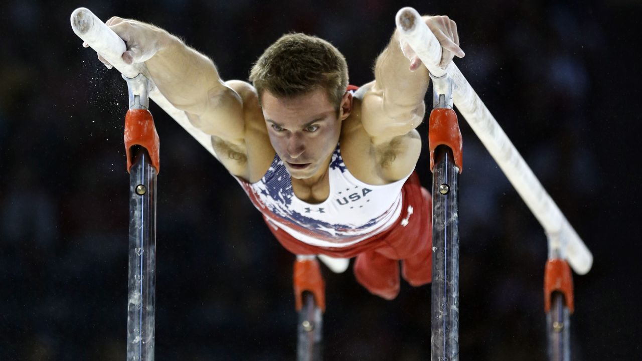 U.S. gymnast Samuel Mikulak competes on the parallel bars during the Pan American Games on Saturday, July 11. Mikulak and the Americans won gold in the team competition.