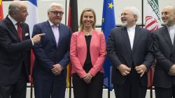 French Foreign Minister Laurent Fabius, German Foreign Minister Frank-Walter Steinmeier, European Union High Representative Federica Mogherini, Iranian Foreign Minister Mohammad Javad Zarif and Head of the Iranian Atomic Energy Organization Ali Akbar Salehi pose for a picture prior to their final plenary meeting at the United Nations building in Vienna, Austria, Tuesday, July 14, 2015. After 18 days of intense and often fractious negotiation, diplomats Tuesday declared that world powers and Iran had struck a landmark deal to curb Iran's nuclear program in exchange for billions of dollars in relief from international sanctions, an agreement designed to avert the threat of a nuclear-armed Iran and another U.S. military intervention in the Muslim world. (Joe Klamar/Pool Photo via AP)