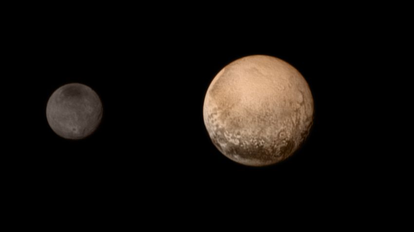 In this handout provided by the National Aeronautics and Space Administration (NASA), the dwarf planet Pluto (R) and Charon are shown July 11, 2015. 