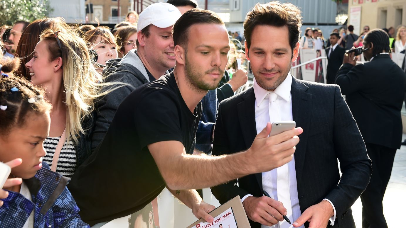 A fan takes a photo with actor Paul Rudd at the London premiere of "Ant-Man" on Wednesday, July 8.