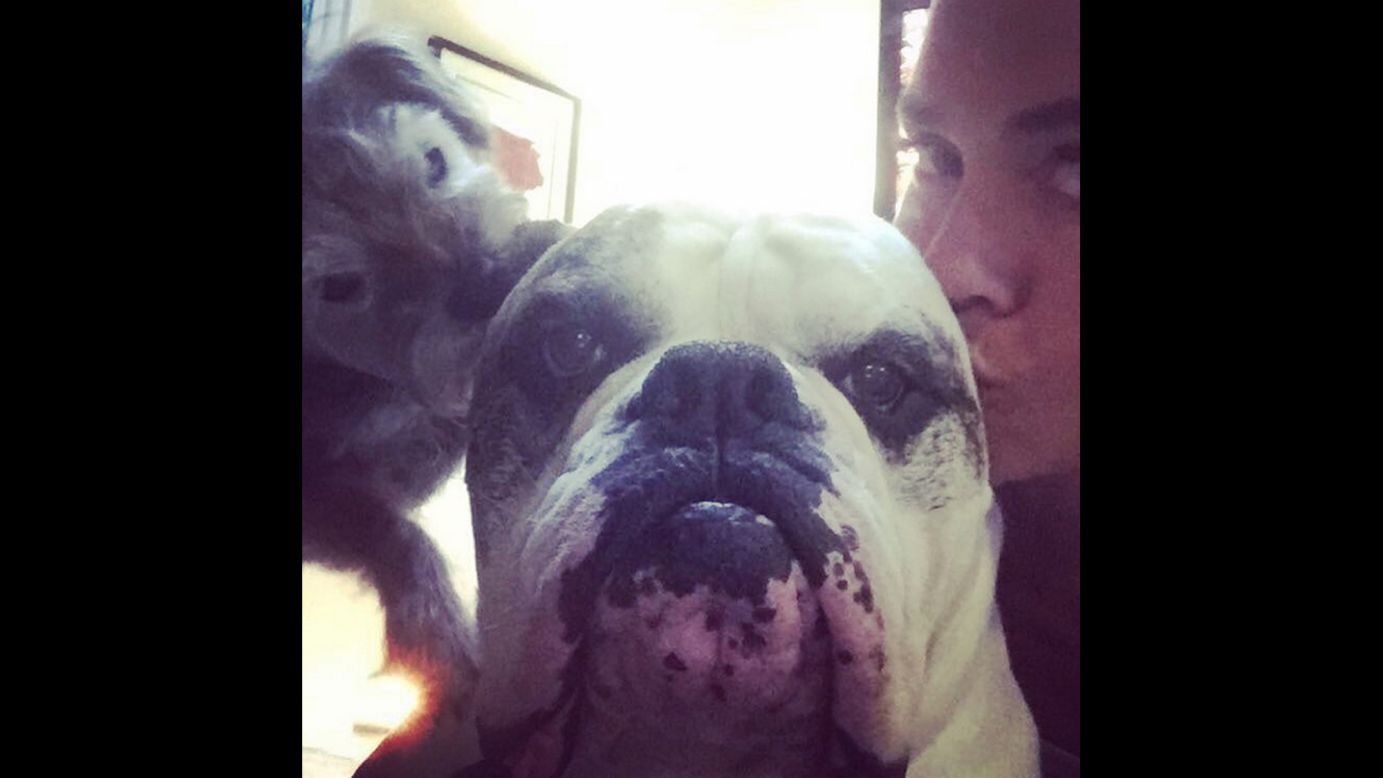 U.S. swimmer Natalie Coughlin kisses one of her dogs on Wednesday, July 8. "He gets all the ladies," <a href="https://instagram.com/p/445KjmhDzk/" target="_blank" target="_blank">she wrote on Instagram. </a>