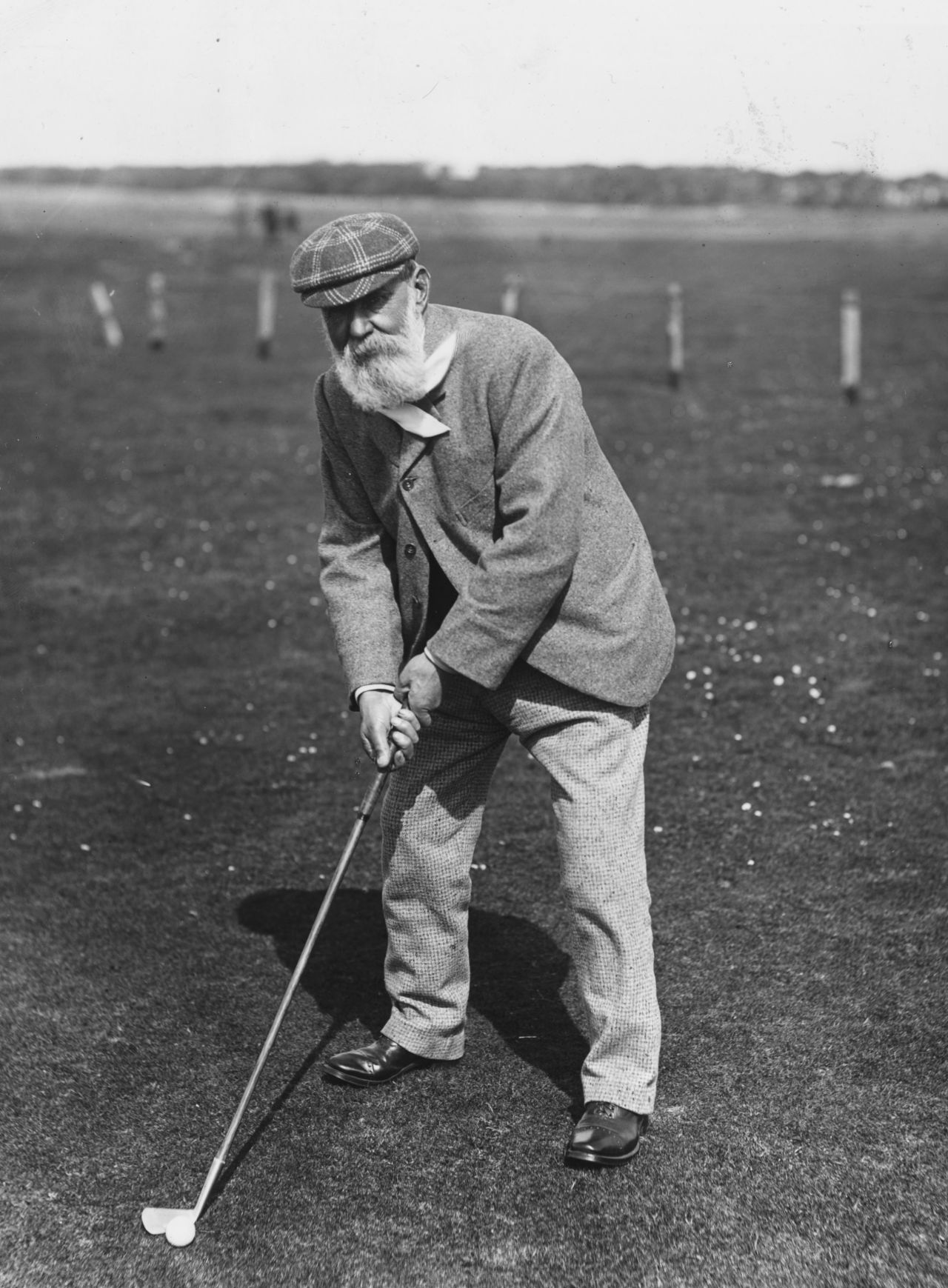 Old Tom Morris, photographed around 1880, won the Open Championship four times. Dressed in hard-wearing and warm tweed, Morris, the son of a weaver, is widely regarded as the first professional golfer.   <br /><br />"The early Open champions started to be known as pros," explains Fleming. "They won money in competitions and were backed by the gentlemen golfers who would act almost like sponsors. They would bet against one another, put up prize money, trophies."      