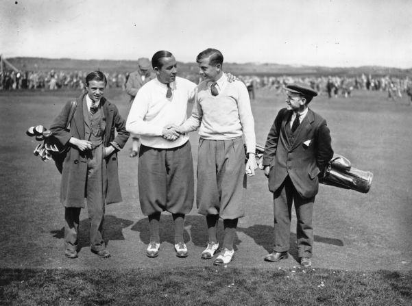 U.S. golf star Walter Hagen (left) shakes hands with Britain's Henry Cotton after the American won his fourth and final Open Championship at Muirfield in 1929. Dressed in plus fours, shirts, ties and v-neck sweaters, the pair were a dapper sight on the course. <br /><br />"Walter Hagen loved wearing smart clothing and was known to talk about being a millionaire. He really liked bright colors," Fleming said.  