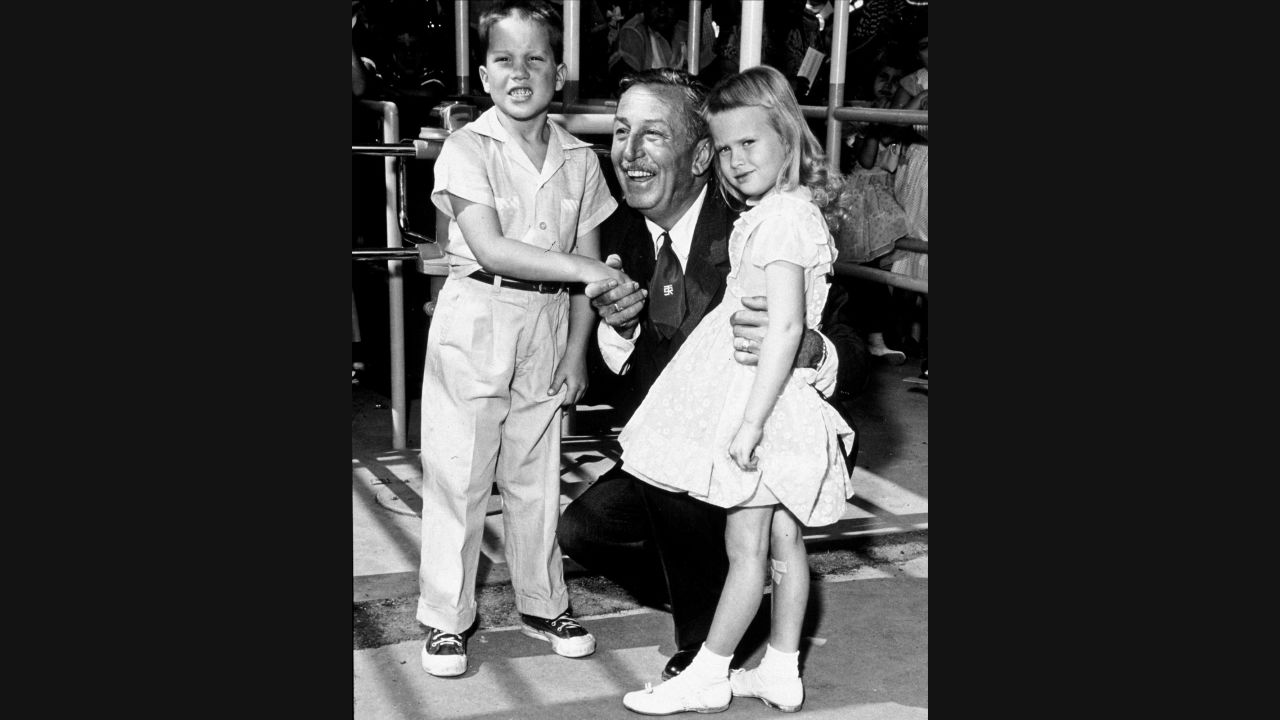 Walt Disney, seen here posing with the park's first two official visitors, Michael Schwartner, 7, and Christine Vess, 5, didn't let that first day stop him. He rallied his staff and spent days and nights addressing problems with rides, capacity, food service and merchandise. After only seven weeks, the park had recorded 1 million guests -- and 3.8 million by the end of the first fiscal year. 